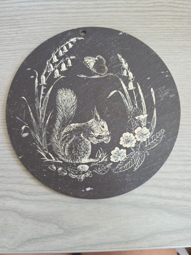 Round slate plaque with - round, etches
